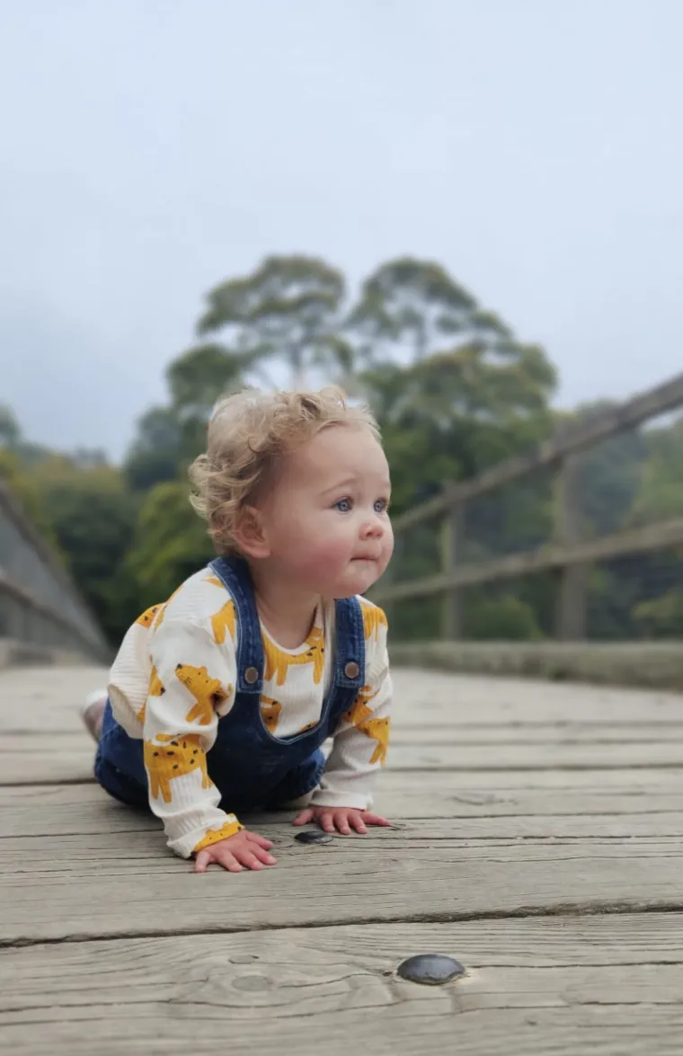 Baby crawling outdoors