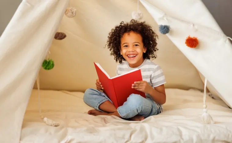 Early years child reading a book