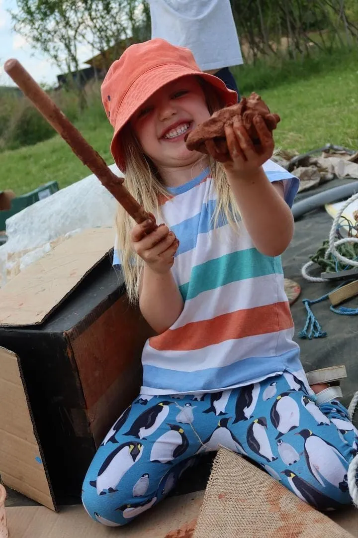 Child playing with clay