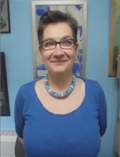 Woman with short hair and glasses