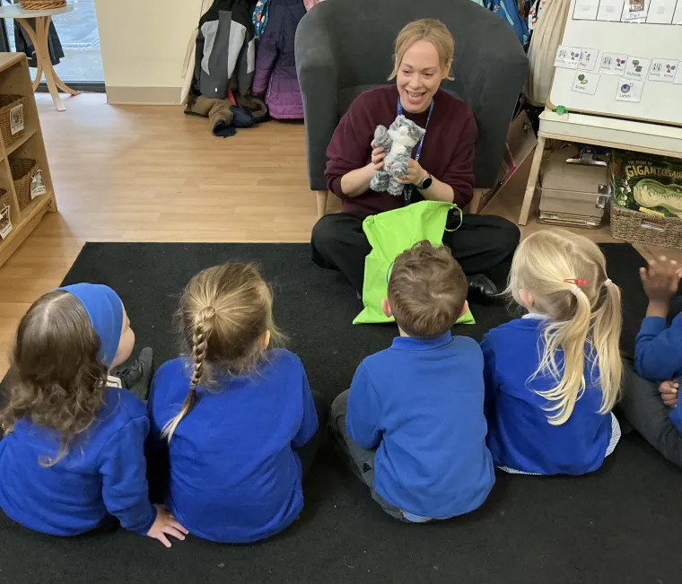 children looking at a concept cat toy