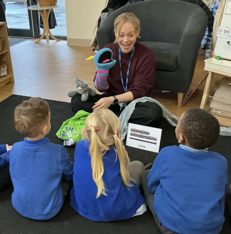 Children watching a puppet