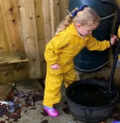 Girl using water butt