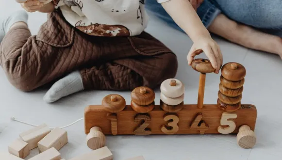 Child playing with number toy