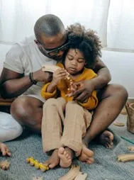 Man supporting child