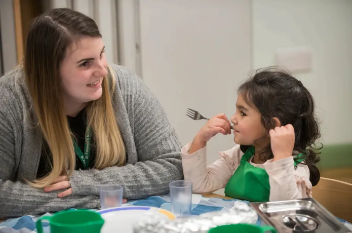 Practitioner engaging with child.