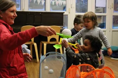 Children playing with fake snowballs