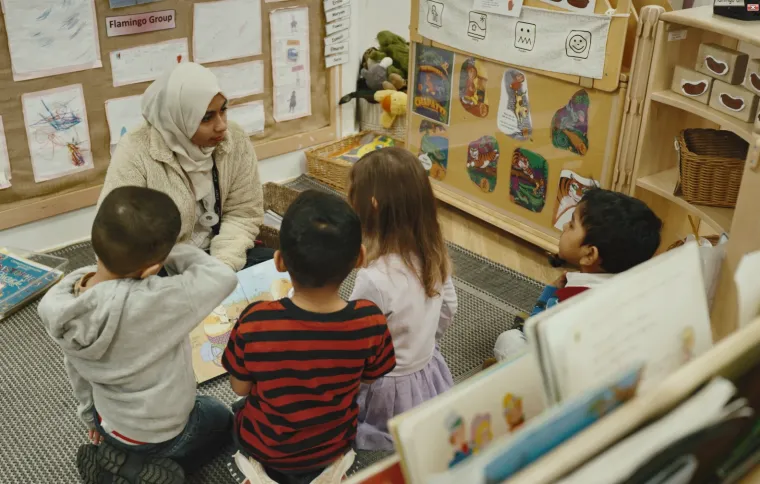 Early years children listening to a story
