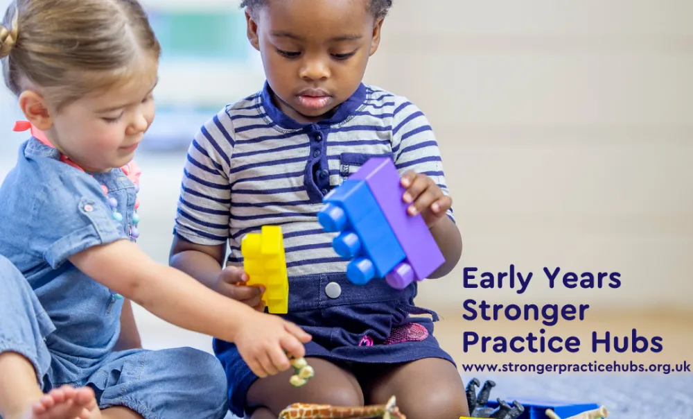 Two young children playing with blocks in a nursery setting