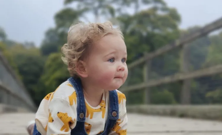 Baby crawling outdoors