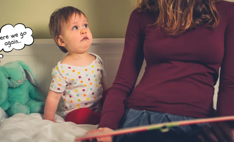 Child looking worried as book is being read by adult
