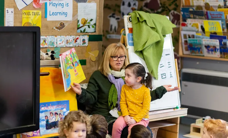 Early years children listening to a story