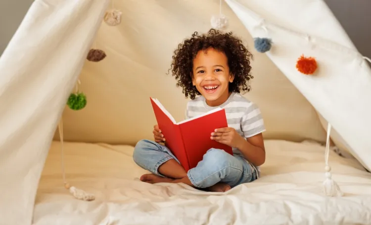 Early years child reading a book