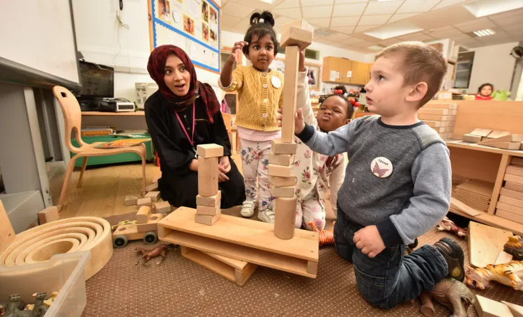 Children playing with wooden blocks