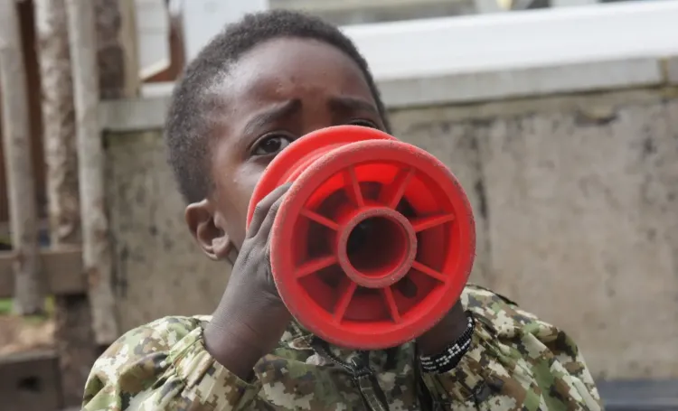 Child playing with an outdoor toy