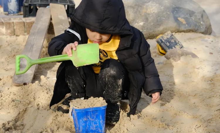 Child playing with sand.