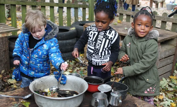 Children playing in mud kitchen