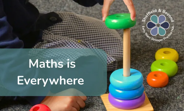 Image of young child playing with maths equipment.