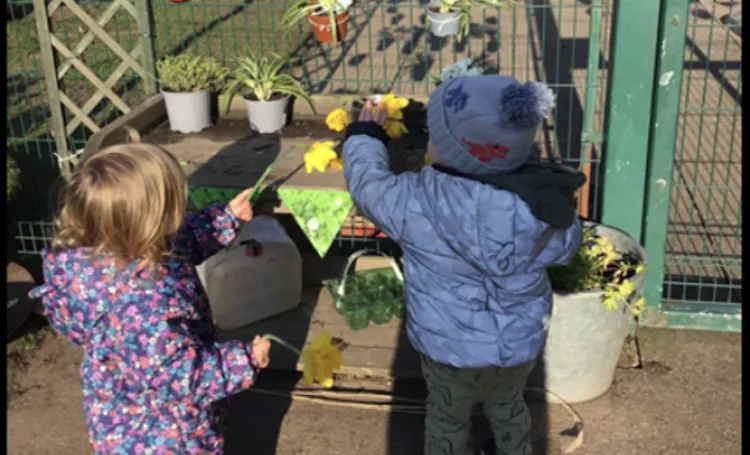 Children playing with flowers