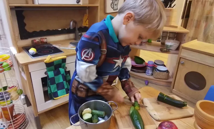 Early years child in home corner
