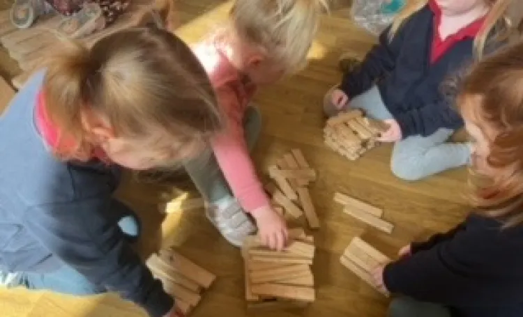 Children working together playing with blocks