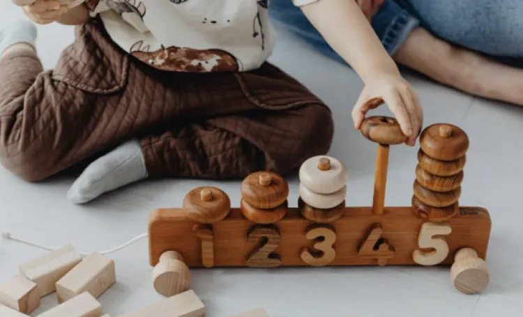 Child playing with number toy