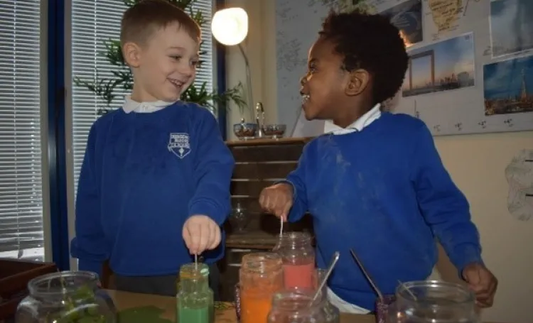Early years children laughing