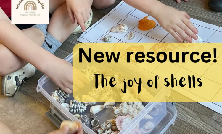 Children's hands playing with seashells, putting them into boxes on a paper grid. 