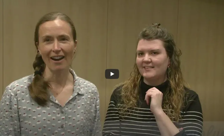 Two women speaking