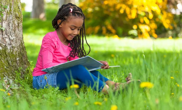 Child Reading Outside