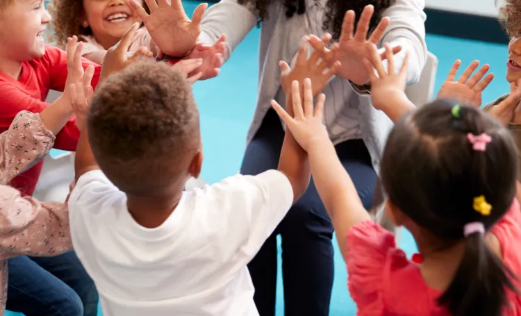 Image of Teacher Supporting Children