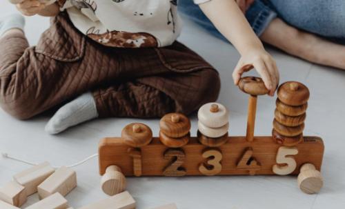 Child playing with number toy